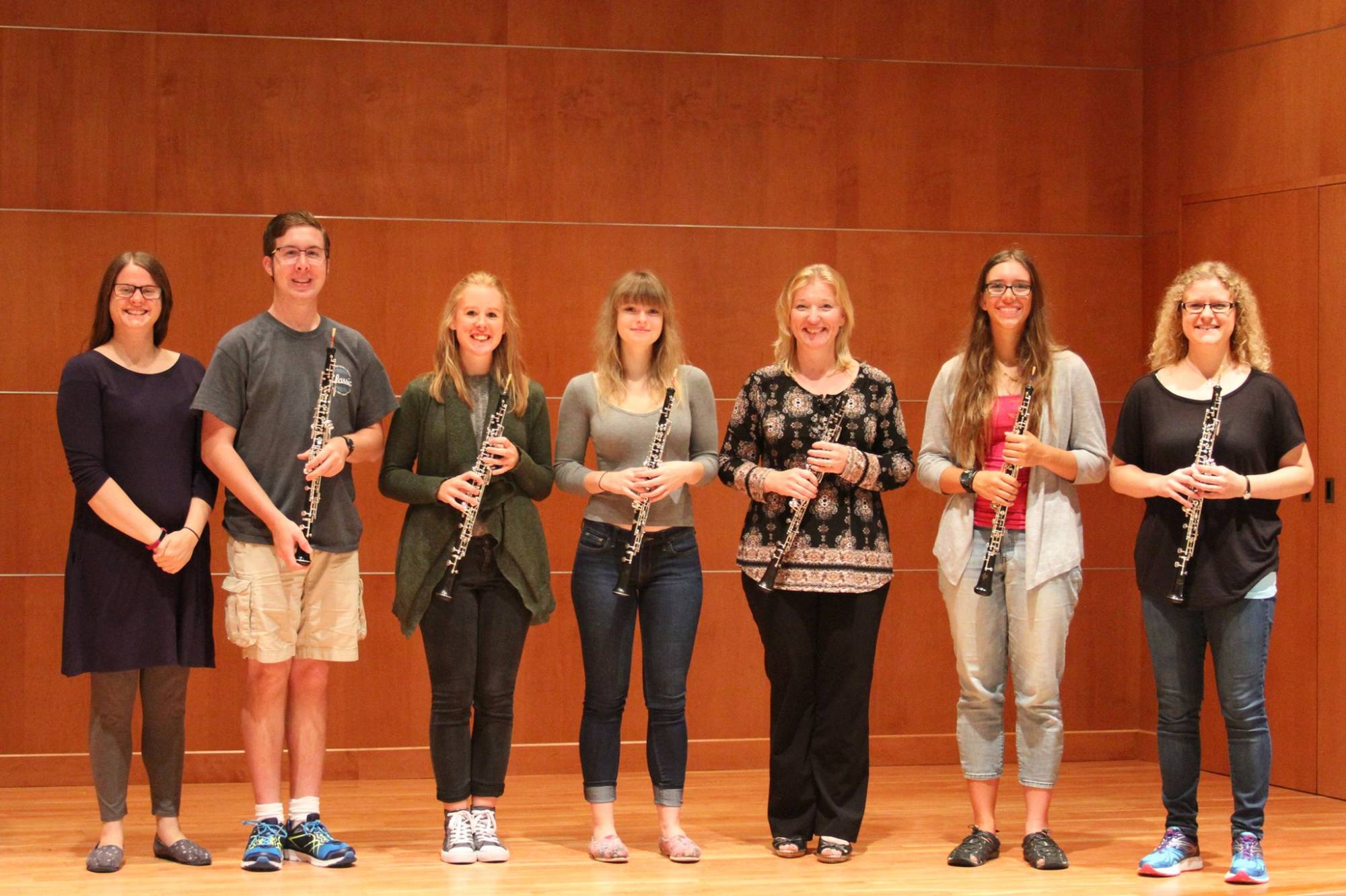 GVSU oboists in the Sherman Van Solkema Recital Hall holding their oboes